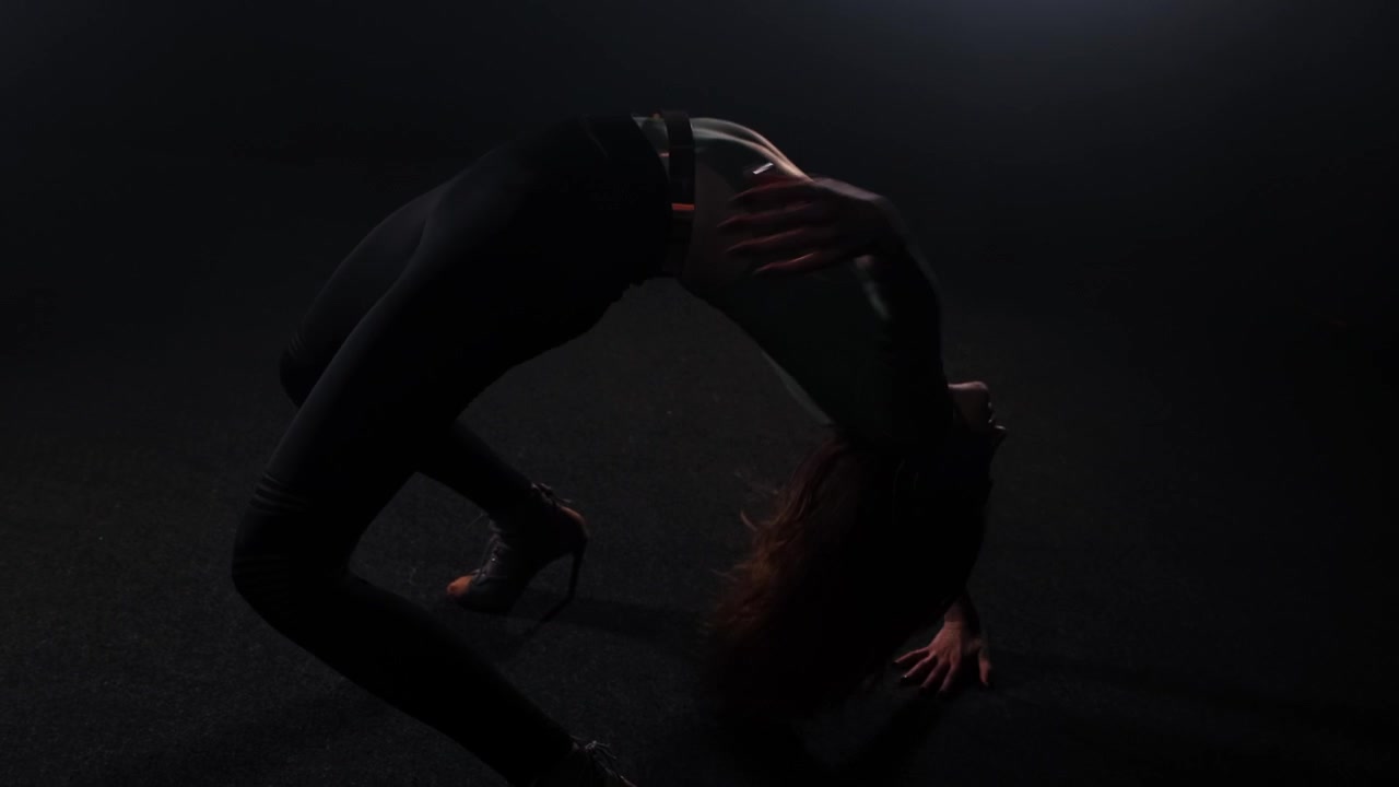 Vogue dancing in studio full of smoke attractive slim woman dancing
