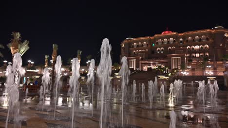 nighttime glow of abu dhabi's iconic emirates palace hotel in the uae