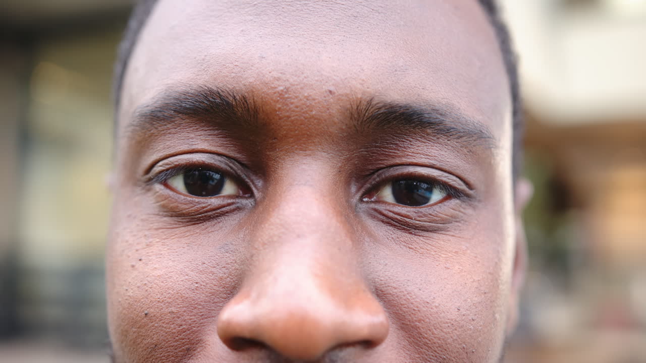 Smiling, close-up of person's face with clear skin and bright eyes, at home
