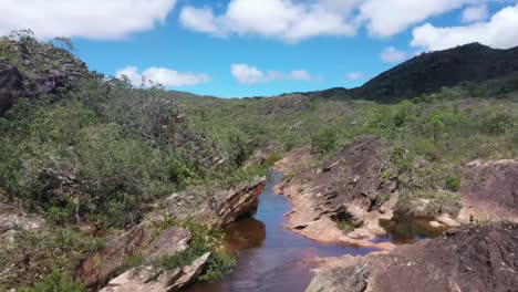 Drone-view-of-river-channel-passing-under-the-old-bridge