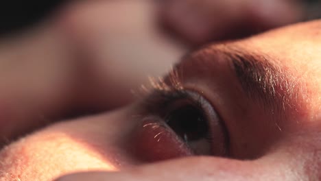 close up of a man's eye illuminated by the soft afternoon light, showing the concept of wellness, mindfulness and mental health