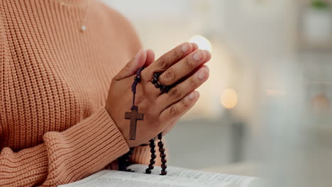 praying hands, rosary and woman with bible at home