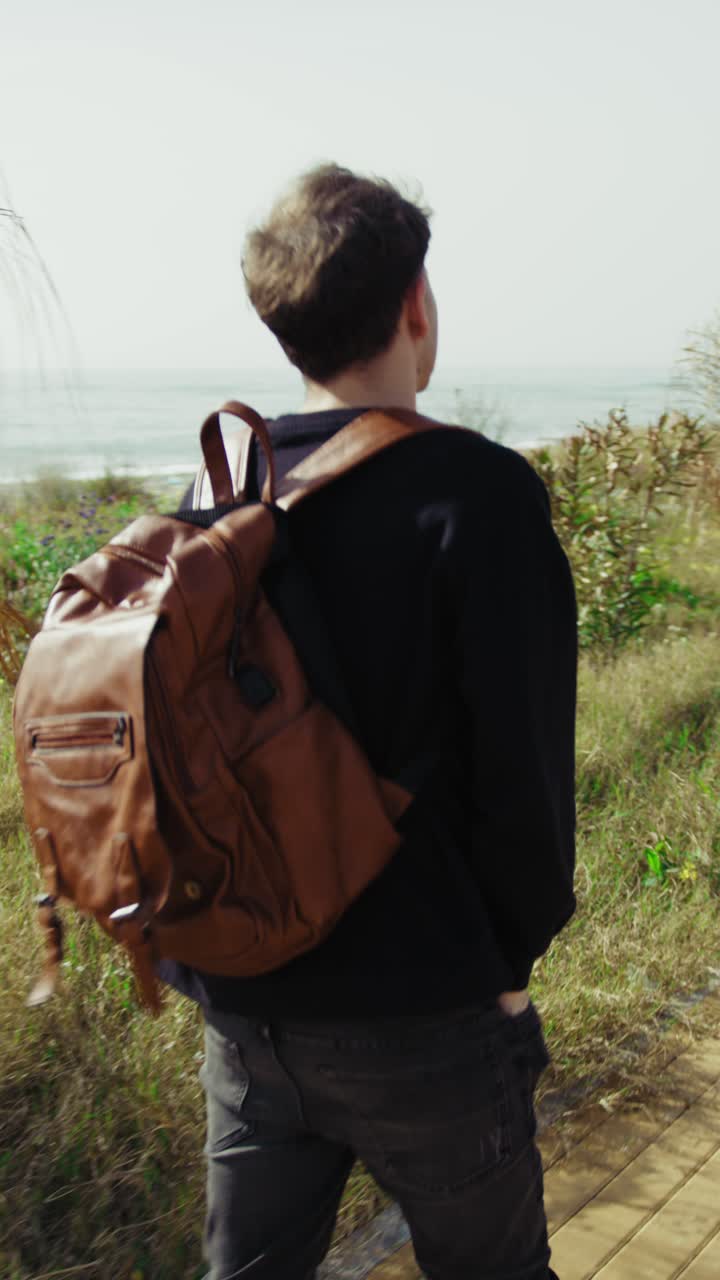 Man Finishes His Moment Of Relax Near The Sea And Starts Going Home