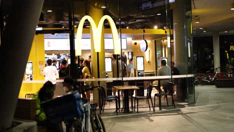 customers dining and interacting at a fast food outlet.