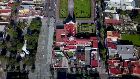 top drone view of a catholic church in the charming town of chalco mexico, and view of the downtown and roads towards mexico city