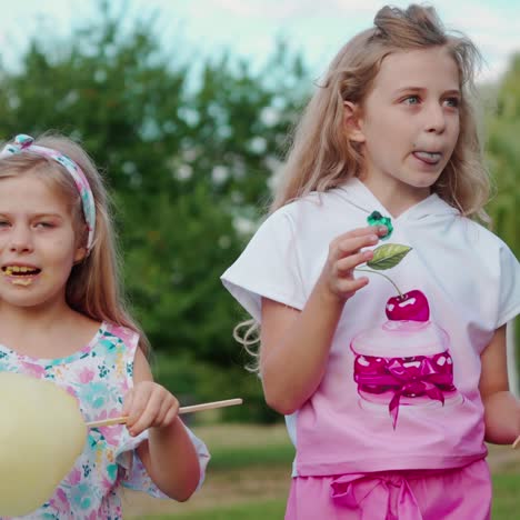 cute girls eating cotton candy