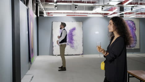 couple viewing modern art at an exhibition