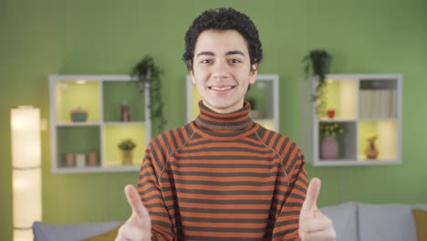 happy boy is satisfied and giving approval. okay sign.