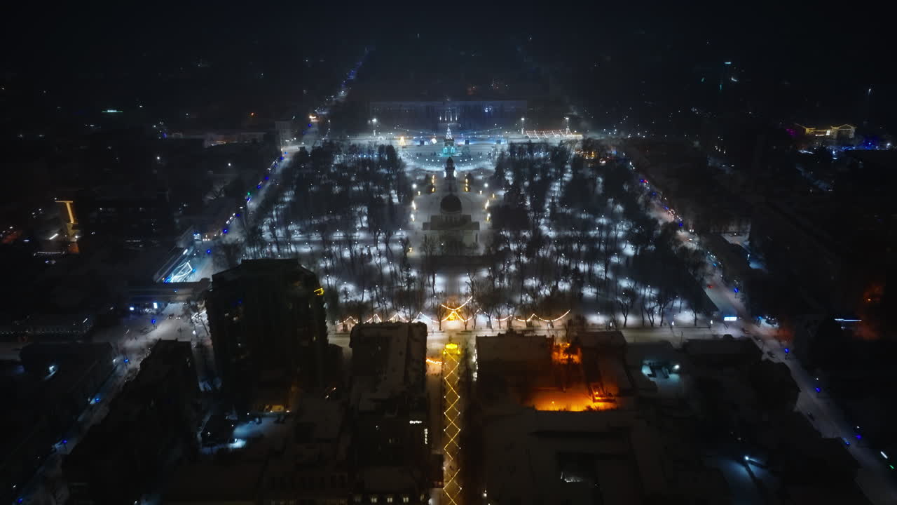 Aerial drone view of Chisinau center city covered in snow. Cathedral and Government building at night. Moldova