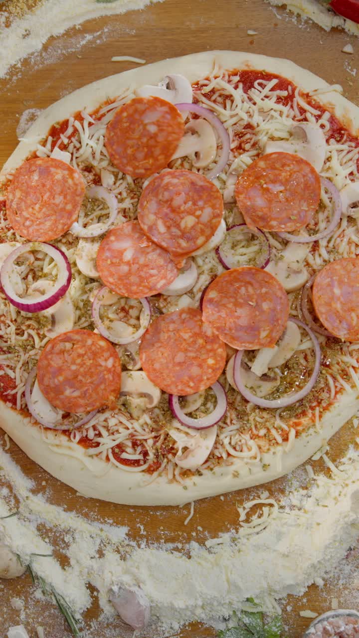 Making a Pepperoni Pizza with Red Onion and Mushrooms