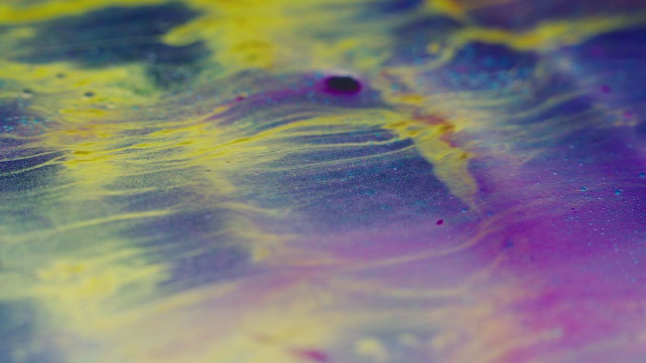 Colourful, organic, liquids macro shots buzzing and flowing