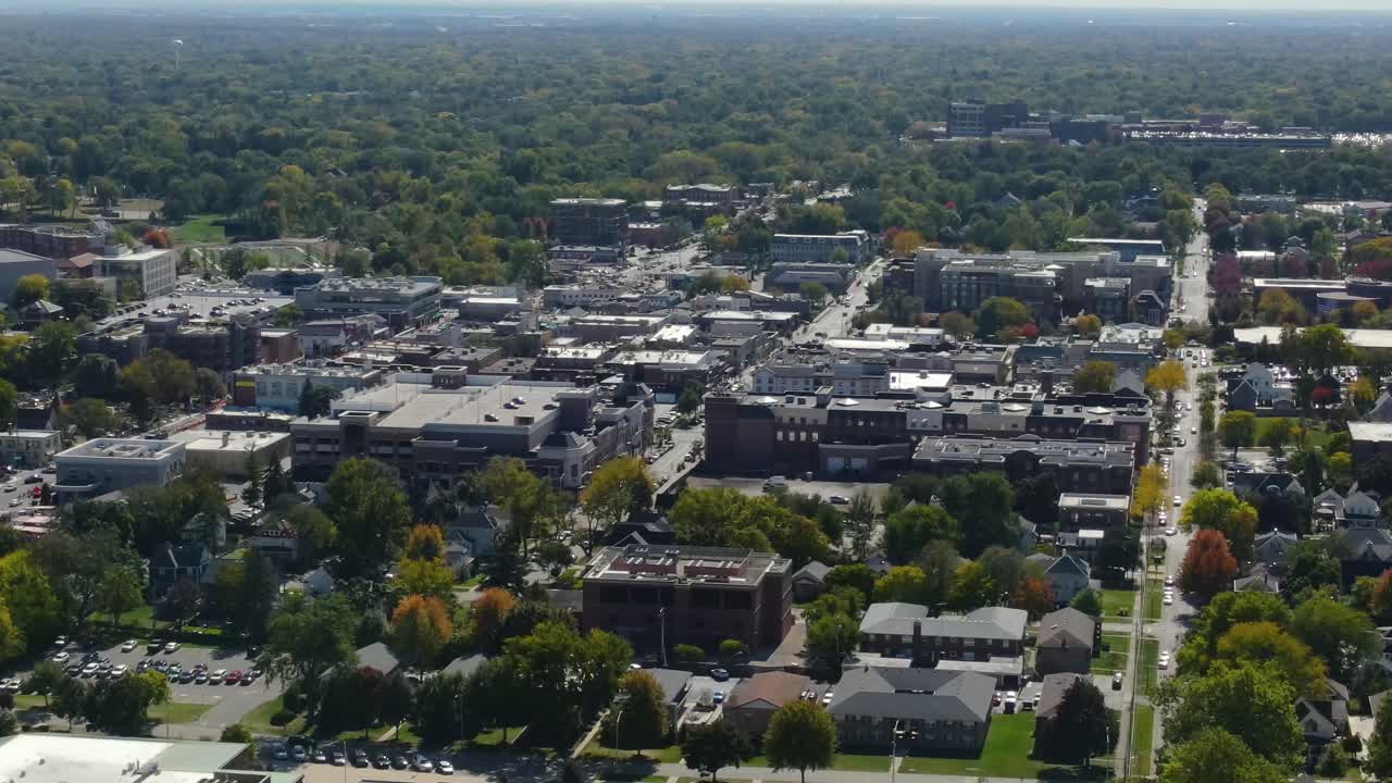 Naperville, IL, a Chicago suburb, on a sunny fall day, featuring buildings, streets. Orbit Left Zoom Day S