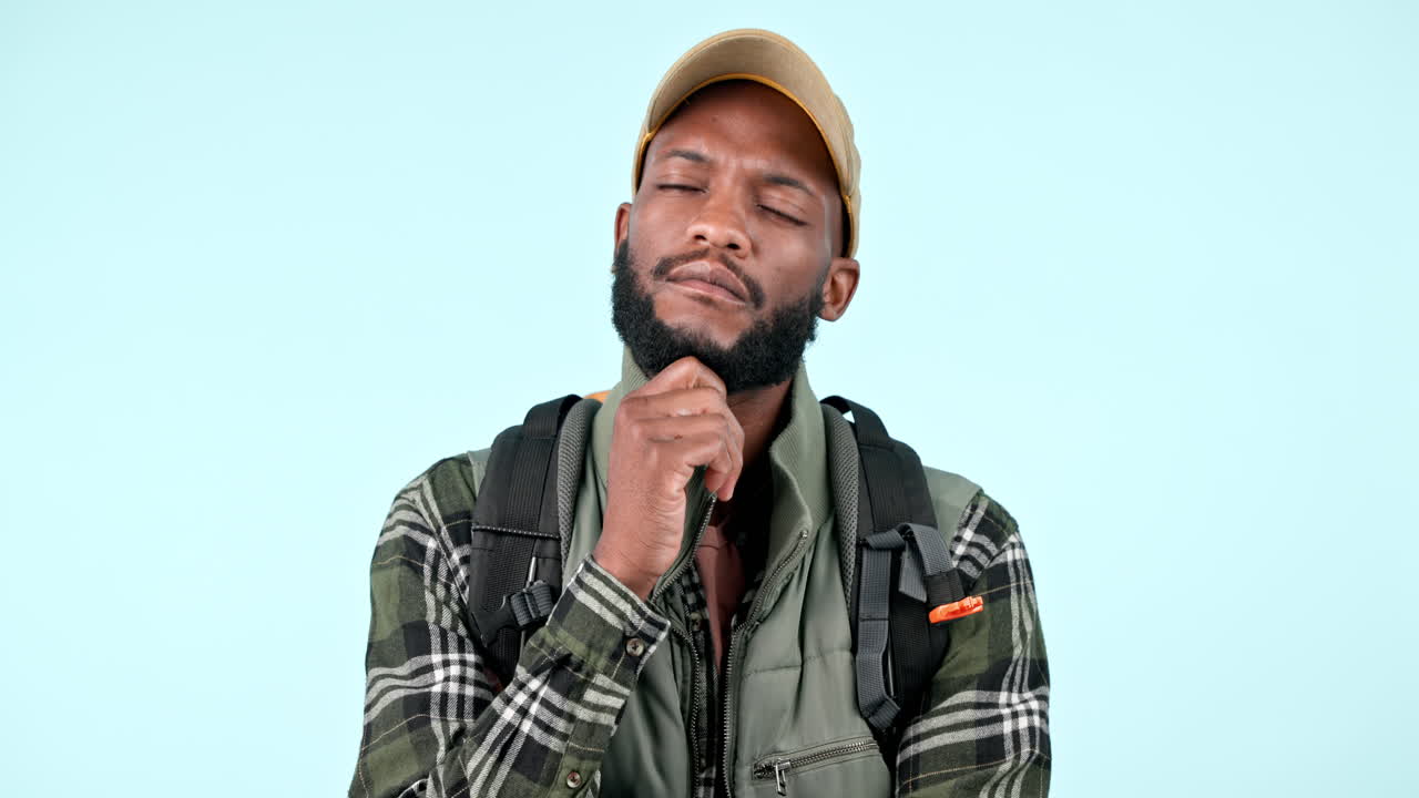 Backpack, thinking and face of black man in studio