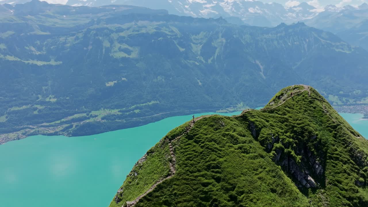 Breathtaking aerial panorama of Hardergrat ridge and emerald Brienzersee below