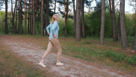 woman stretching in a spring forest