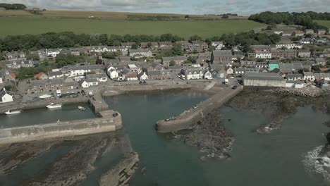 an aerial view of johnshaven harbour and town on a sunny day, taken from the sea, aberdeenshire, scotland, uk