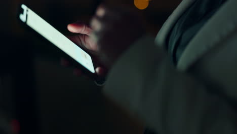 business hands scroll smartphone at night