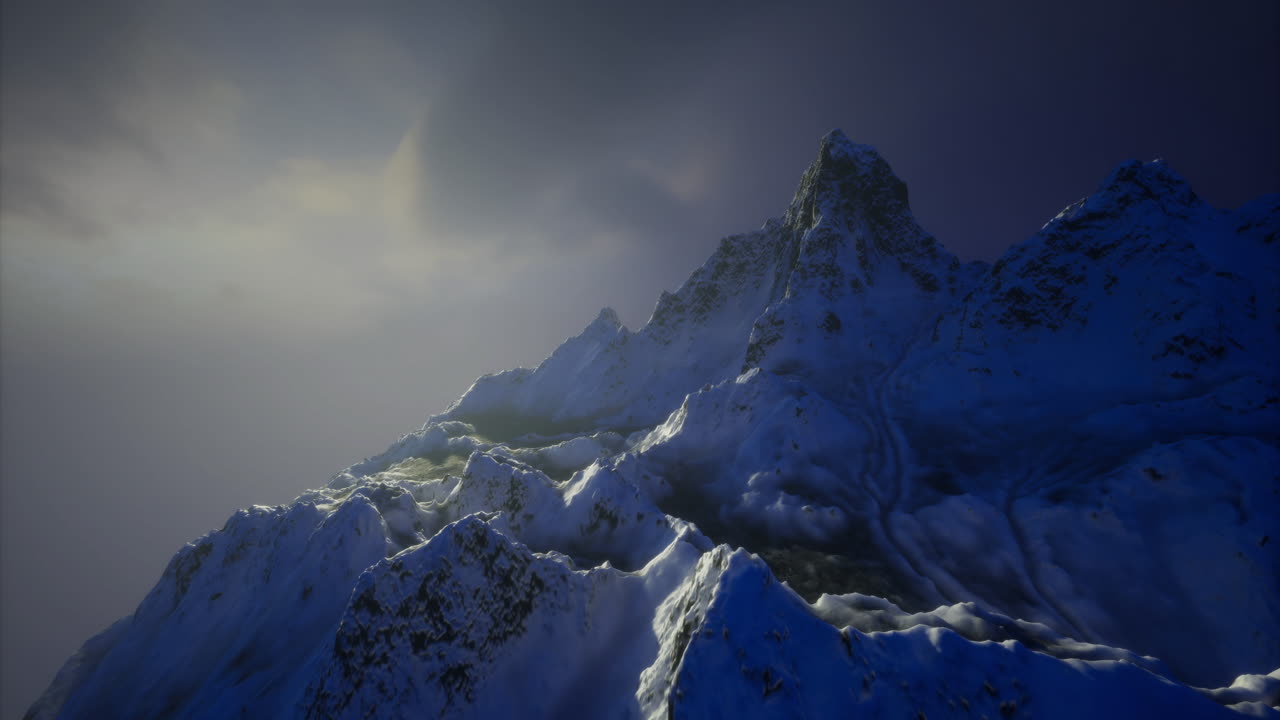 Stunning mountain range illuminated by soft sunset glow in winter