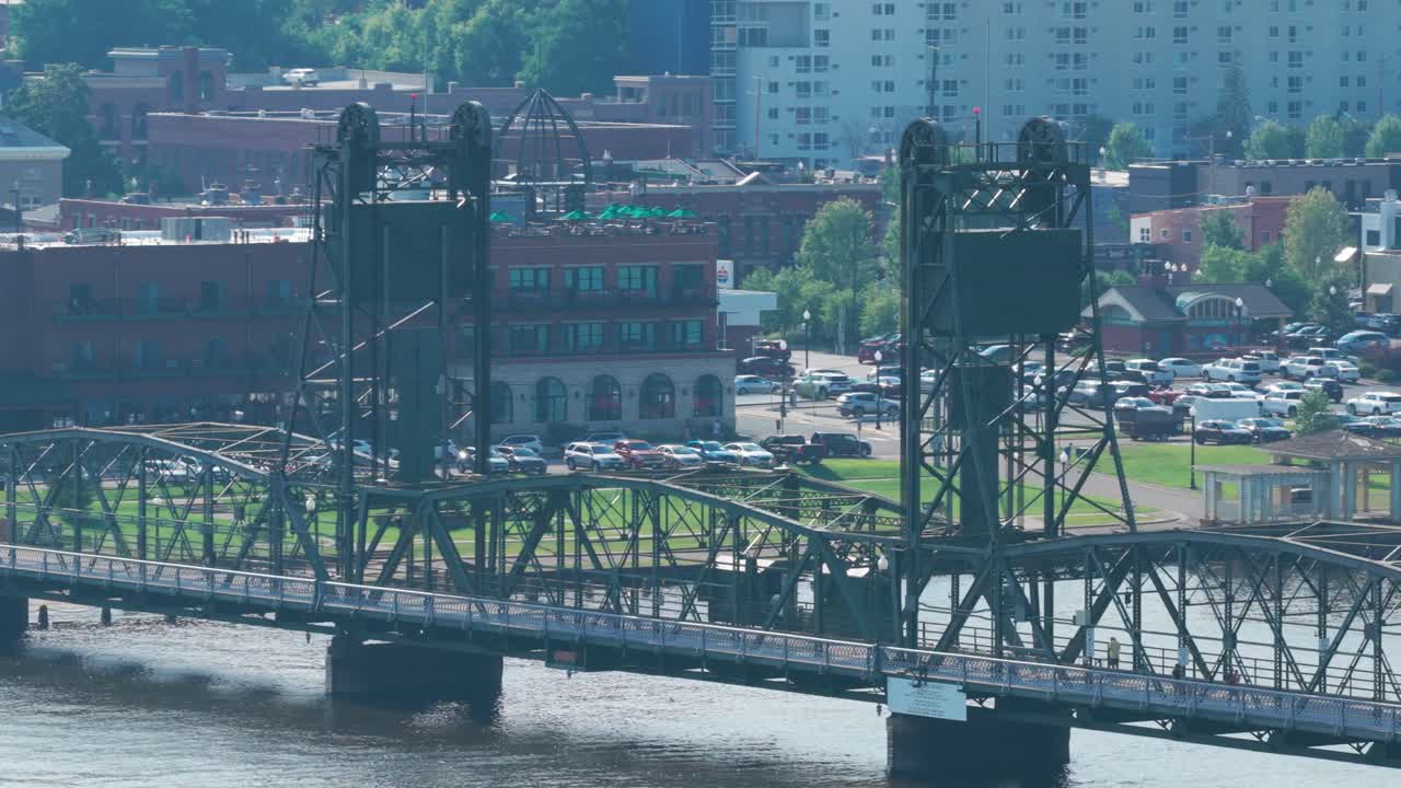 Aerial telephoto close-up panning shot of the lift bridge over the St. Croix River in Stillwater, Minnesota. 4K
