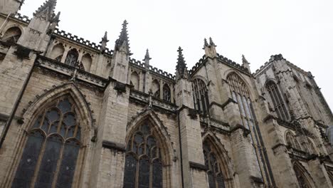 slow panning shot of the beautiful york minster cathedral with cloudy conditions