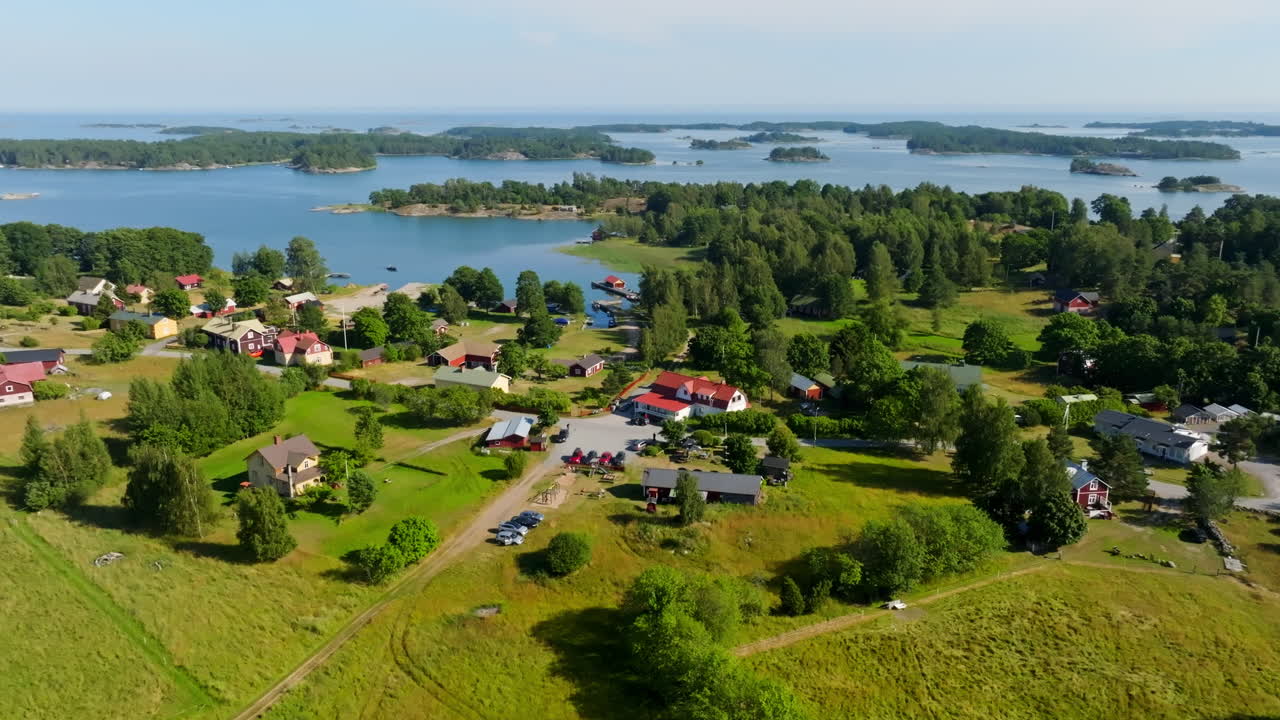Panoramic drone shot around the Hiittinen town, sunny, summer day in Finland
