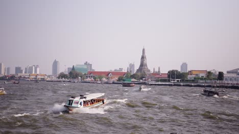 river cruise in bangkok with wat arun in the background