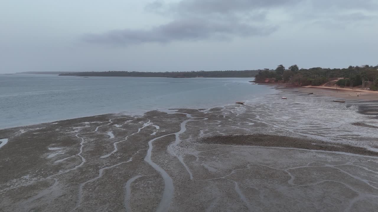 Scenic drone shot of sandbanks and tidal channels emerging along the coast in Guinea Bissau Africa