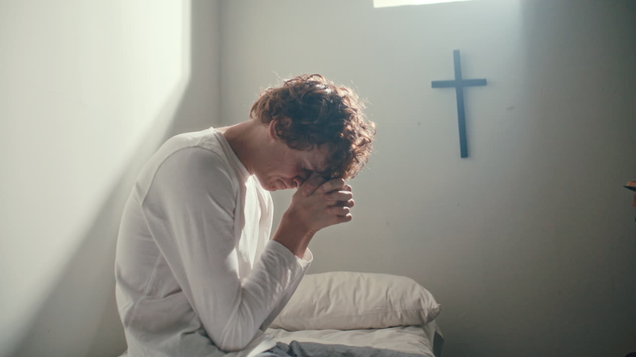 Patient Praying as Priest Reading Bible in Psychiatric Ward