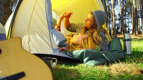 romantic young couple holding hands in tent 4k