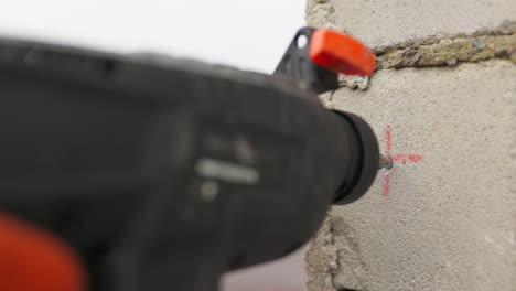 drilling a hole in a brick wall