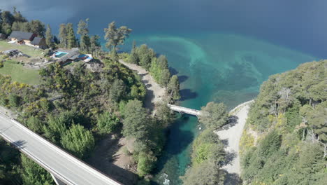 aerial - two bridges over correntoso river, neuquen, argentina, forward tilt down