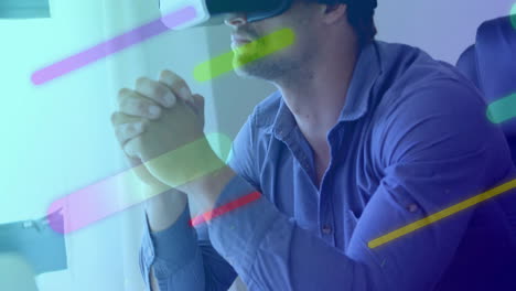 animation of colourful shapes over caucasian man using vr headset