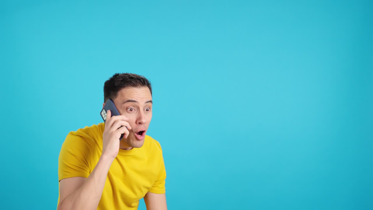 Surprised man talking on phone