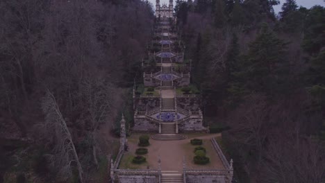 reveal shot of famous santuário de nossa senhora dos remédios with big stairs, aerial