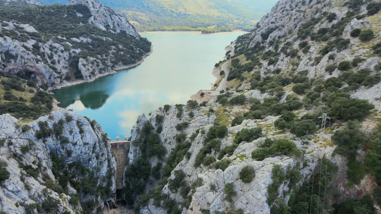 Experience the breathtaking landscapes of Mallorca as you journey through Gorg Blau and the Sierra de Tramuntana. Discover the lush greenery and rugged mountains of this beautiful region.