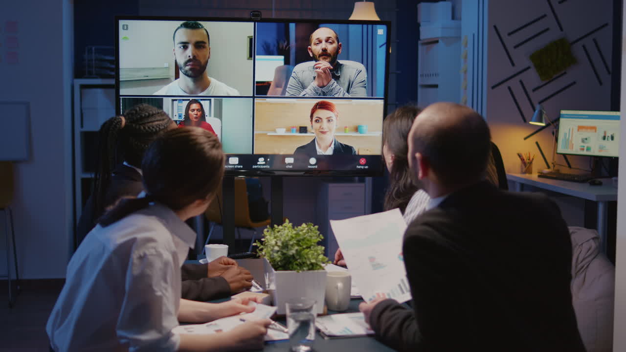 Multi ethnic businesspeople brainstorming company ideas during online videocall conference