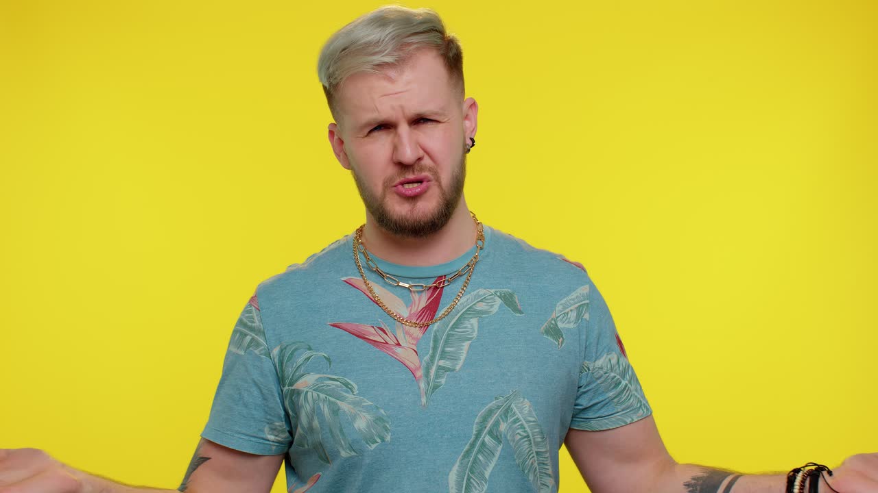 Man raising hands in indignant expression asking why what reason of failure demonstrating disbelief