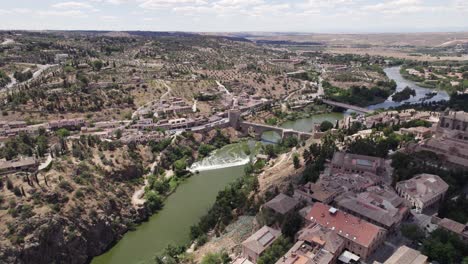 spectacular view of toledo townscape with san martin bridge and river, aerial