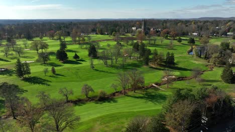 winter view on sunny day of golf course greens