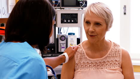 Female-doctor-consoling-a-patient