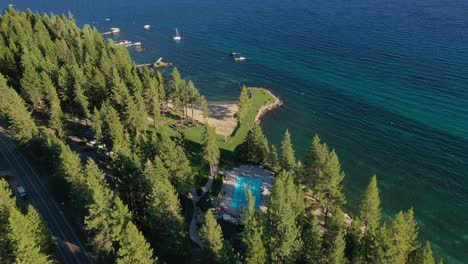 boats sailing in beautiful and calm lake in lake tahoe - aerial shot