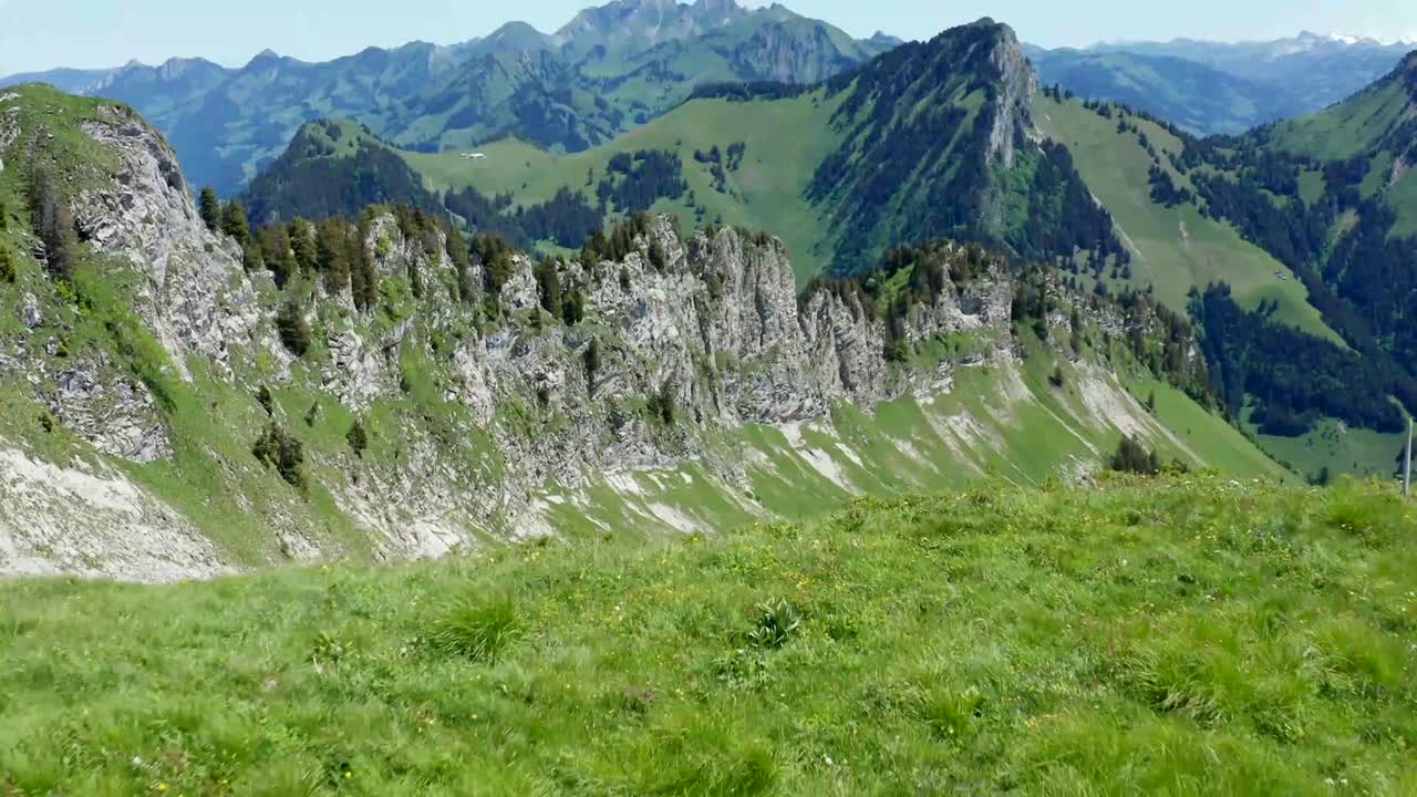 Beautiful mountain landscape showcasing rolling green hills and peaks
