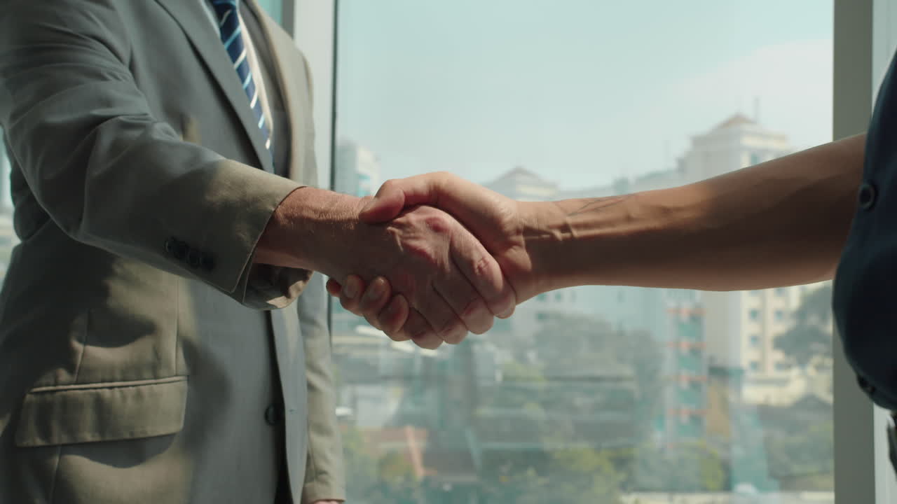 Businessmen Giving Handshake when Meeting at Office