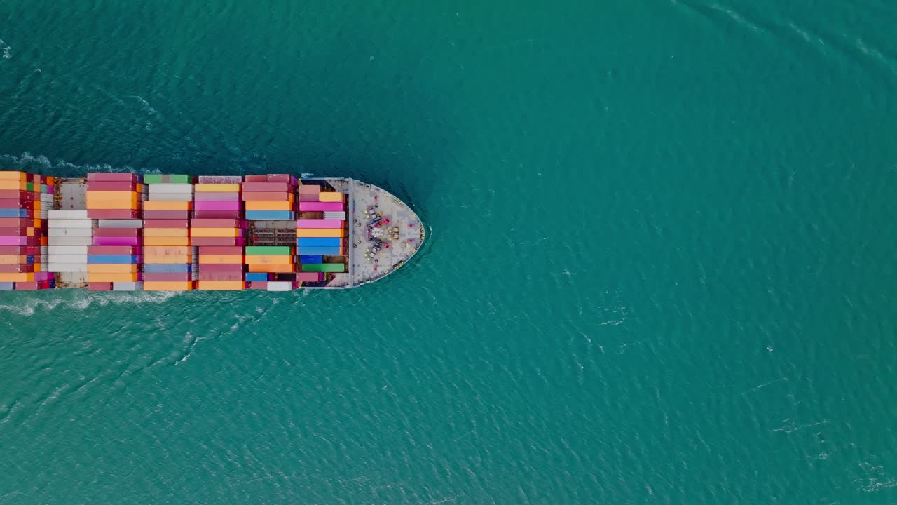 Aerial top down shot from a cargo ship crossing the Panama canal