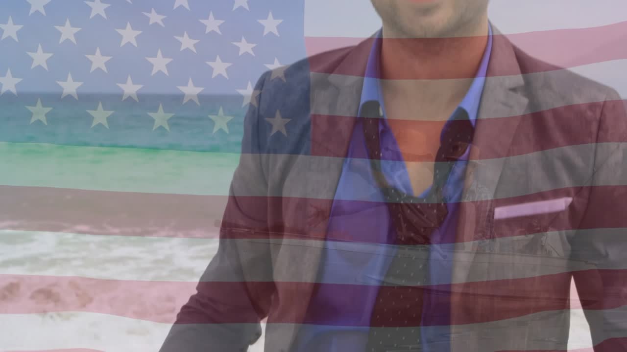 Animación de la bandera de los Estados Unidos de América sobre un hombre afroamericano feliz en la playa.