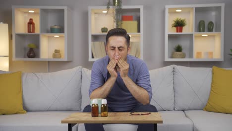 man covering his mouth and nose while coughing.