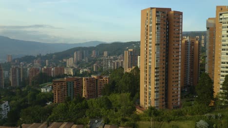 slow pull away from tall apartment buildings in colombia