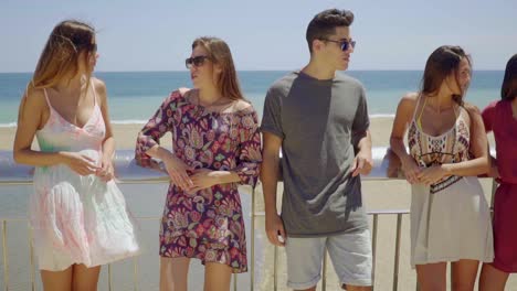 Group-of-teens-hanging-out-near-beach