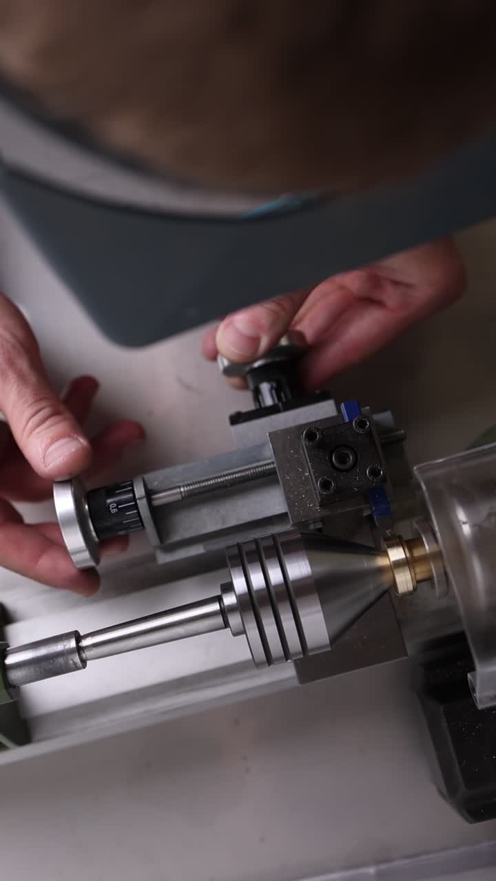 Hands Adjusting a Precision Lathe Machine