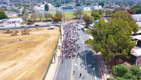 high aerial over large crowds in street black lives matter blm protest march marching through ventura california 1